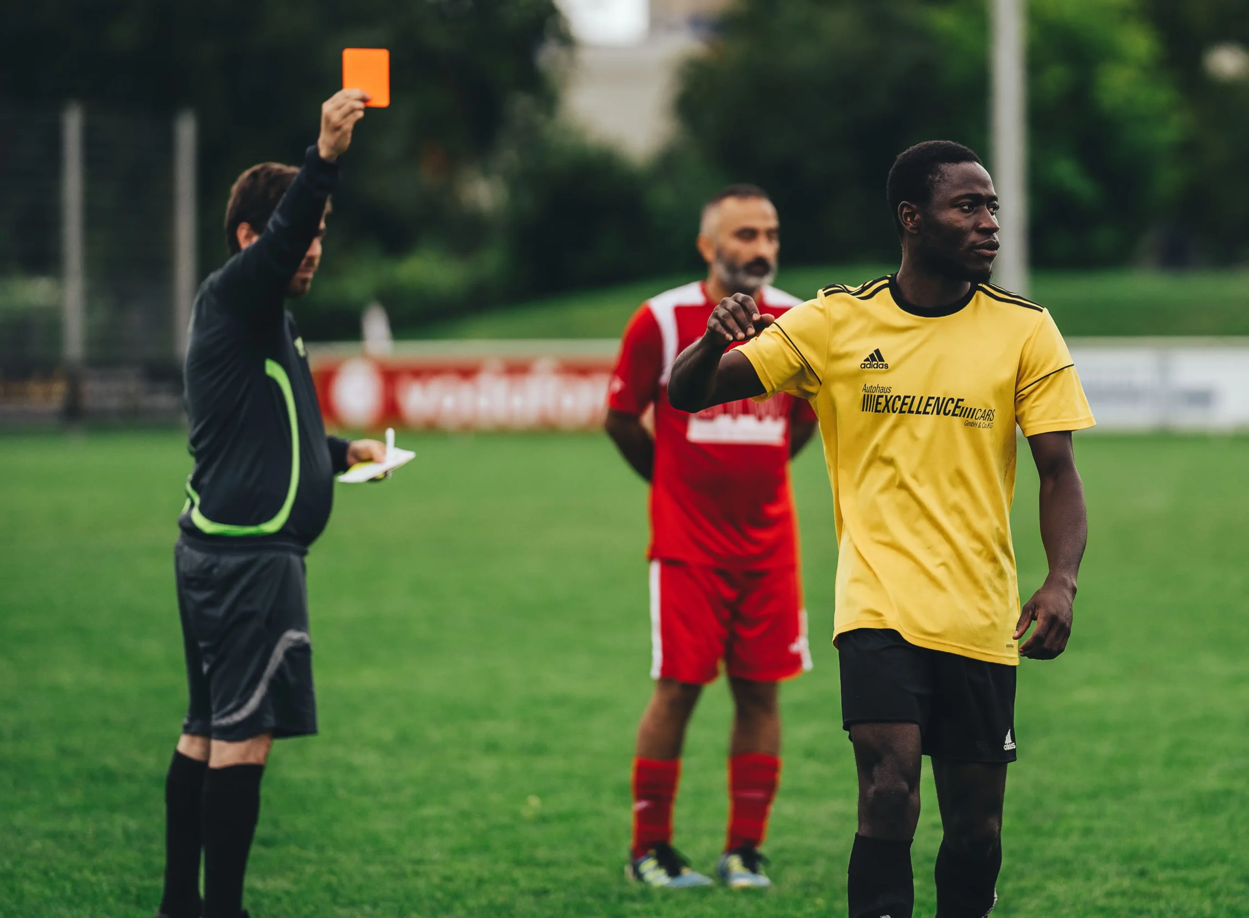 Referee showing red card during a soccer match