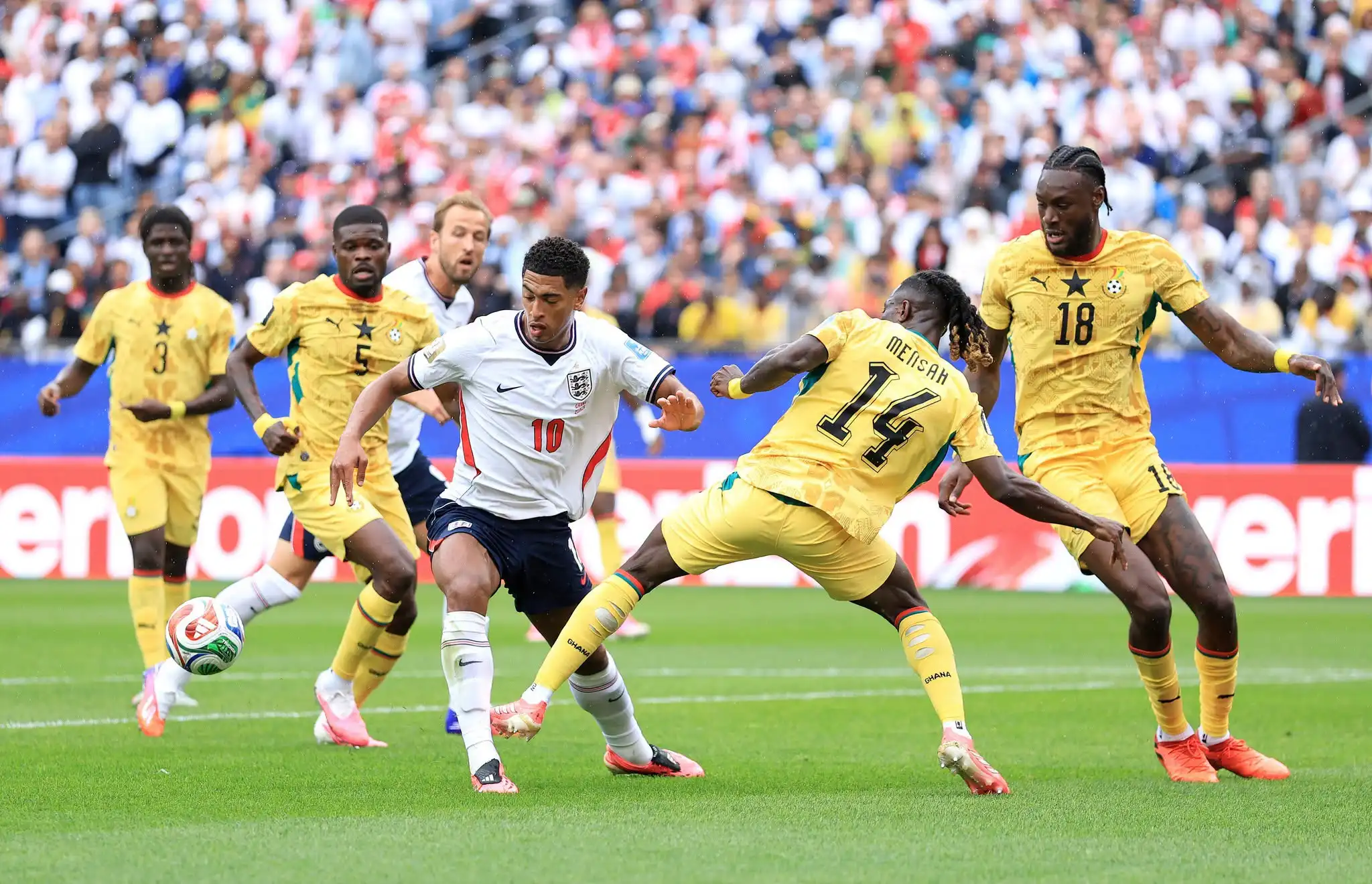 Soccer Players tackling during a match